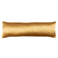 Reverse of kimono bolster pillow in gold silk on a white background.