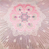 Hanabishi obi flower design with starburst in silver, vintage kimono silk pillow.