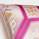 Pale purple silk obi pillow with mauve accents, showing detail of edge of pillow.